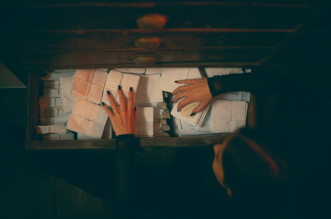 detective reading case files